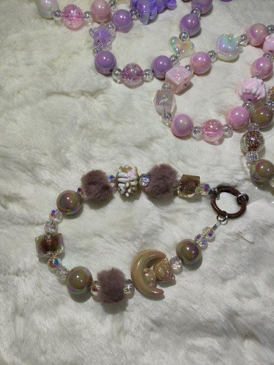 بندهای فانتزی آویزی رنگ صورتی و بنفش و نسکافه ای برای قاب موبایل